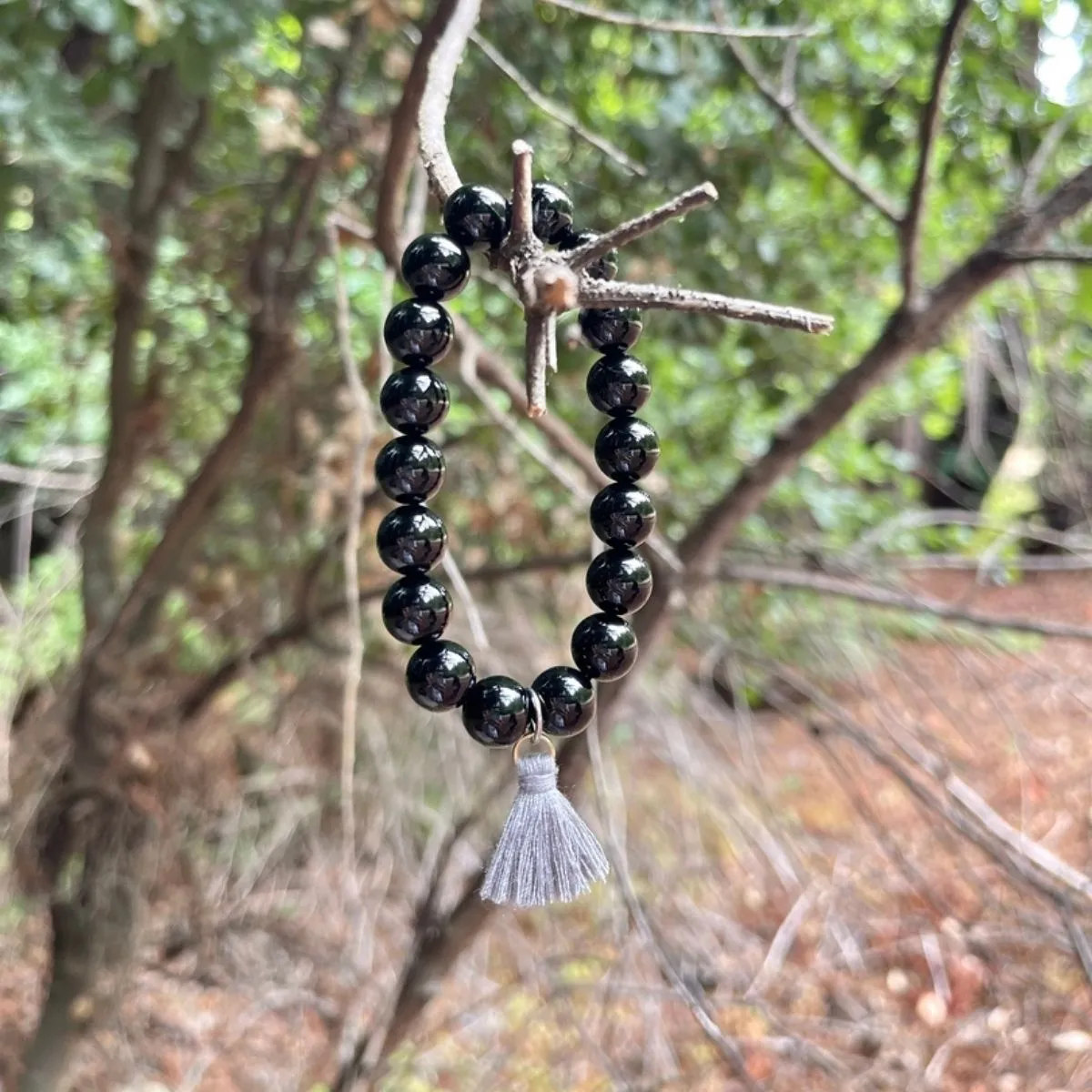 Onyx Bracelet with Tassle to Remind Us that Our Shadows are Parts of Us