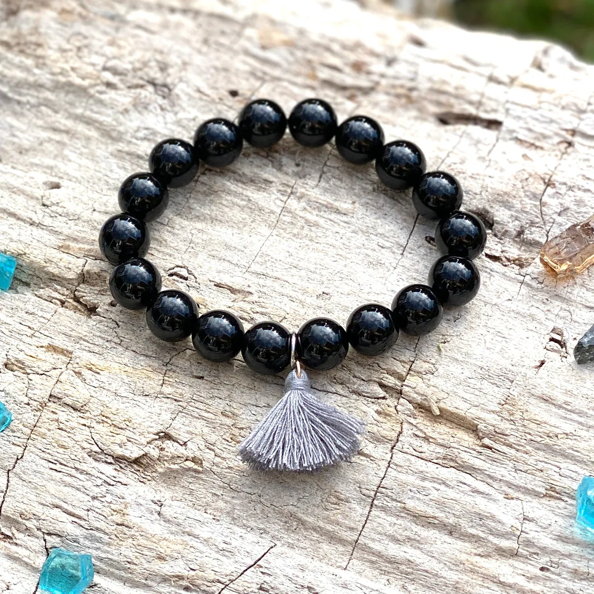 Onyx Bracelet with Tassle to Remind Us that Our Shadows are Parts of Us