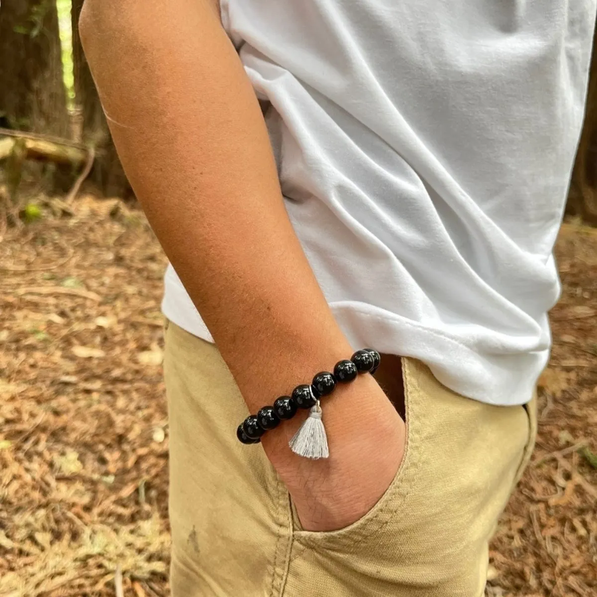 Onyx Bracelet with Tassle to Remind Us that Our Shadows are Parts of Us