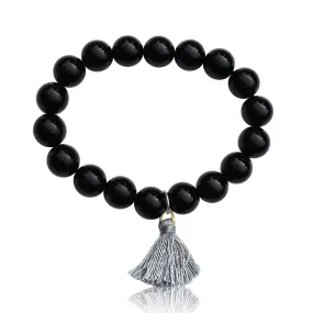 Onyx Bracelet with Tassle to Remind Us that Our Shadows are Parts of Us